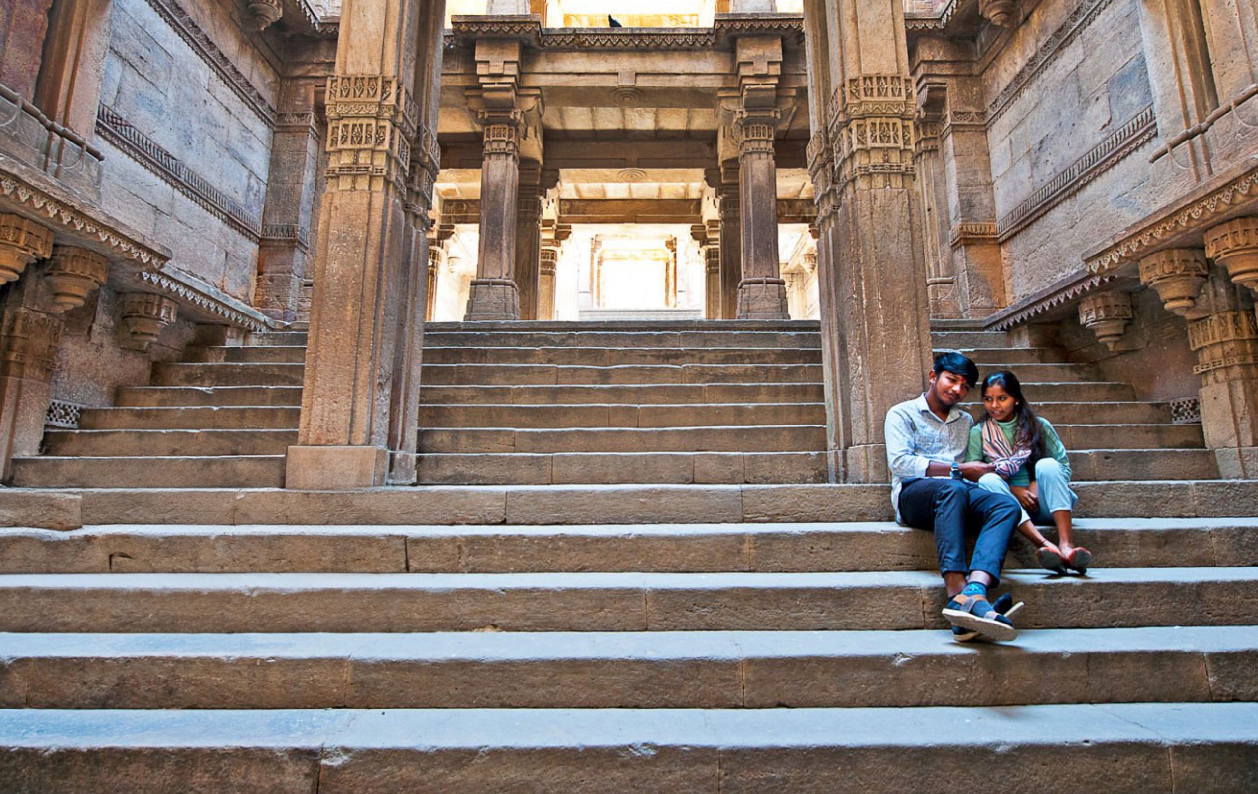 Photo of couple on temple steps in Ahmedabad, India