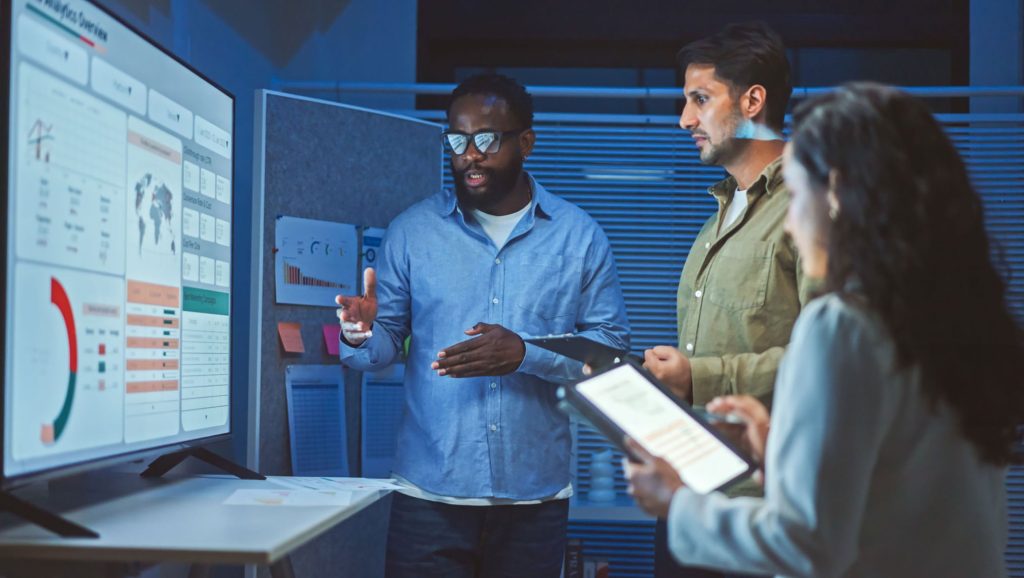 Business team reviewing AI data results