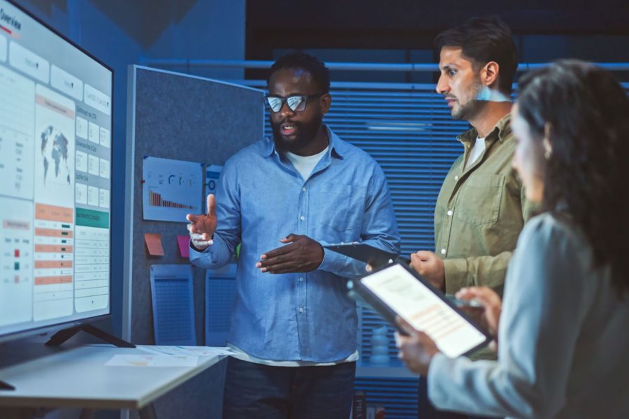 Business team reviewing AI data results
