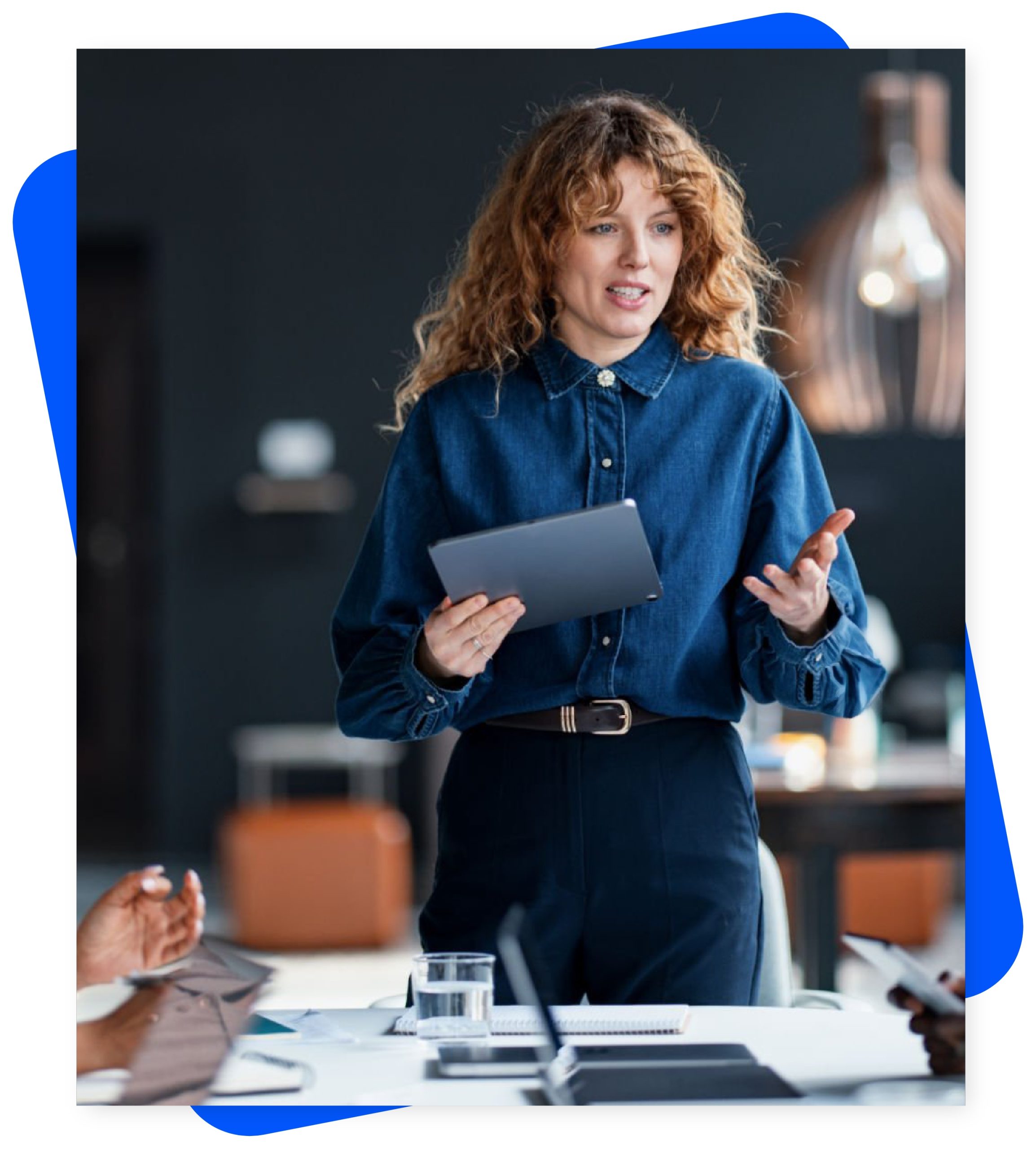 Women with tablet presenting business meeting