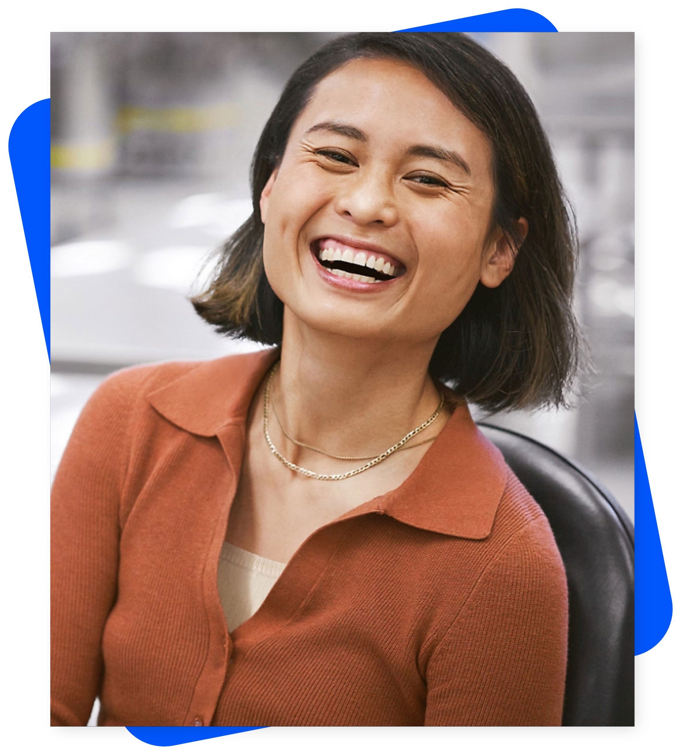 Photo of developer consultant, at work station, smiling