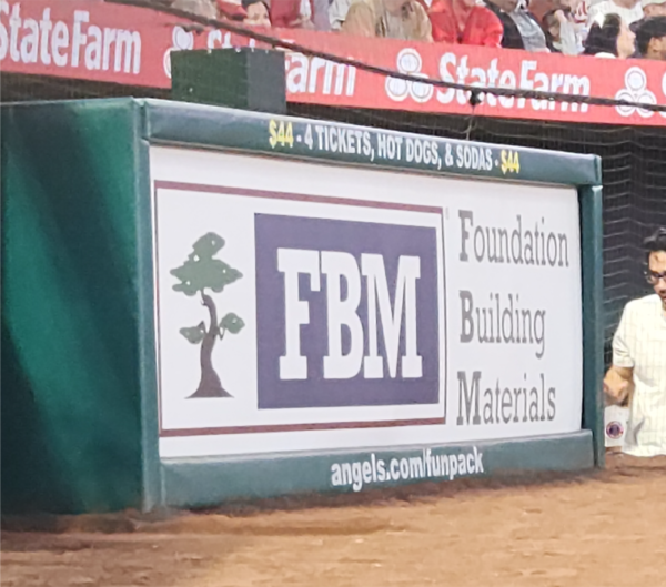 FBM signage behind home plate at Angels Stadium. Automation and Baseball